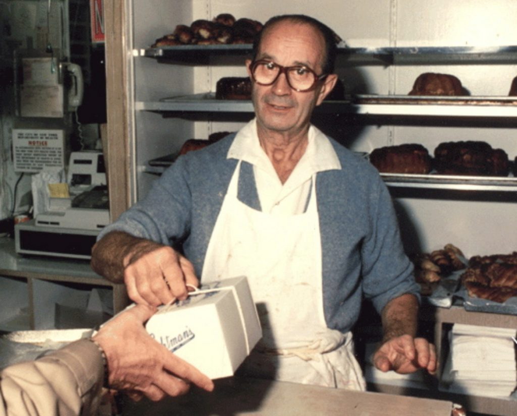 Color Photo of Louis Lichtman at his bakery counter